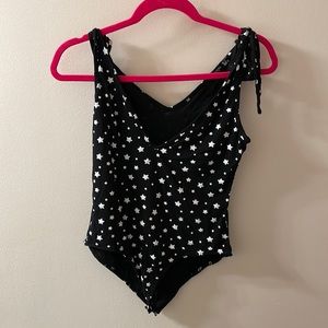 Nasty Gal black and white star body suit with adjustable straps